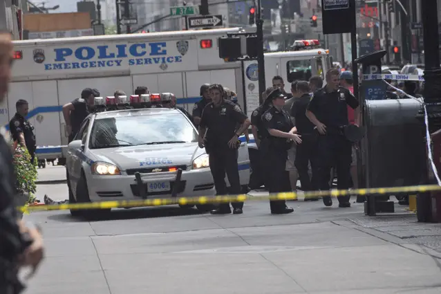 Photo of the scene after the shootingânote the suspect's feet on the left